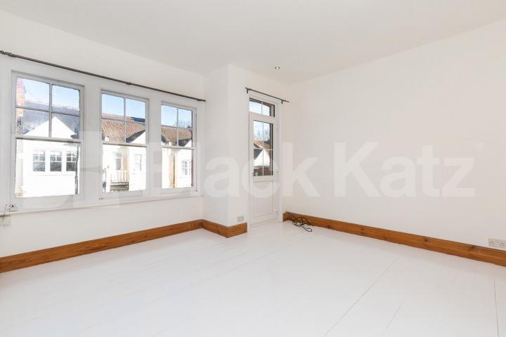 Set on the top floor of a period conversion with high ceilings and exposed brick Rathcoole Gardens, Crouch End